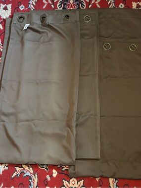 Three panels of Grommet Brown curtains. 40x84in.